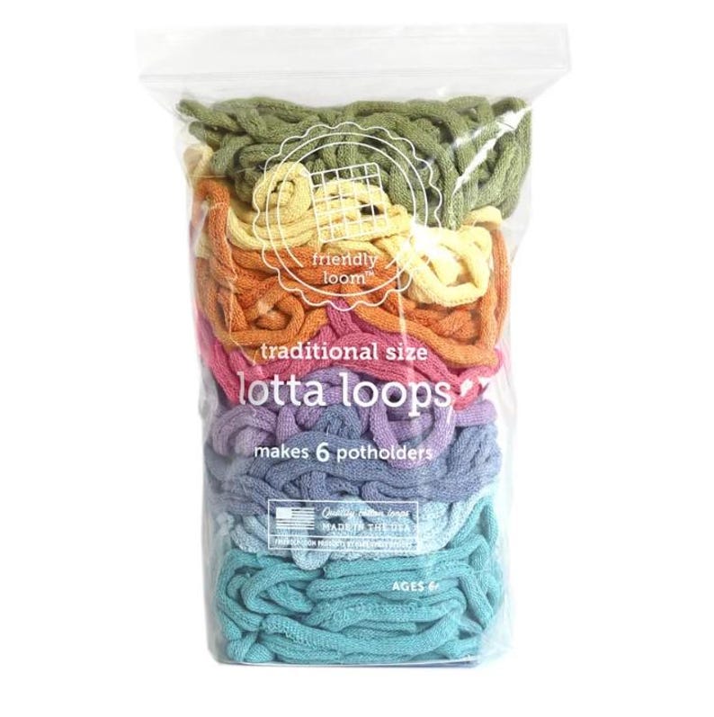 May include: A clear plastic bag filled with six colorful strands of yarn for making potholders. The yarn is arranged in a rainbow pattern, with green at the top and turquoise at the bottom. The bag has a label that reads "friendly loom" and "lotta loops" and states that the yarn makes six potholders.