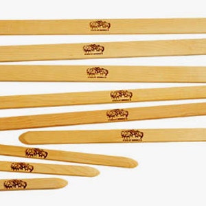 May include: Set of eight wooden knitting needles in various sizes. The needles are made of natural wood and have a smooth finish. Each needle is marked with a number indicating its size.
