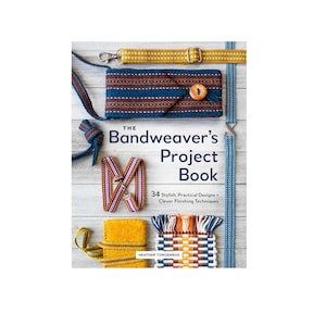 May include: The Bandweaver's Project Book by Heather Torgenrud features 34 stylish, practical designs and clever finishing techniques. The cover displays various woven bands, straps, and textile projects in blue, yellow, orange, and white patterns.