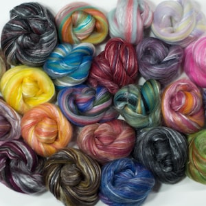 May include: A collection of 20 colorful, hand-spun, and hand-dyed fiber rovings. The rovings are arranged in a circle and feature a variety of colors and patterns.