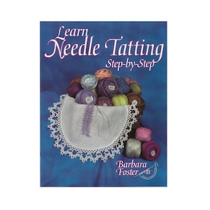 May include: Book cover with the title "Learn Needle Tatting Step-by-Step" by Barbara Foster. The cover features a basket of colorful yarn and a white doily.
