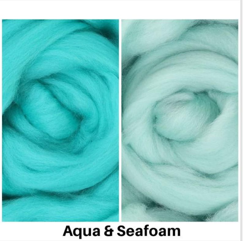 May include: Two swatches of wool roving, one aqua blue and one seafoam green. The wool is soft and fluffy, perfect for felting or spinning.