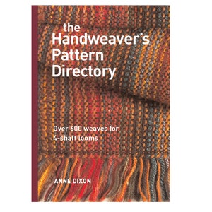 May include: The Handweaver's Pattern Directory book cover features a close-up of a woven fabric with a fringe. The fabric is a mix of red, orange, brown, and blue colors. The book title is "The Handweaver's Pattern Directory" and the subtitle is "Over 600 weaves for 4-shaft looms". The author's name is "Anne Dixon".