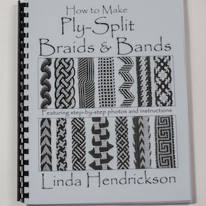 May include: A book titled "How to Make Ply-Split Braids & Bands" featuring step-by-step photos and instructions by Linda Hendrickson. The cover shows various examples of braids and bands.