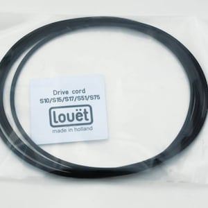 May include: A black drive cord for Louët spinning wheels, models S10, S15, S17, S51, and S75. The cord is packaged in a clear plastic bag with a white label that reads "Drive cord S10/S15/S17/S51/S75 Louët made in holland."