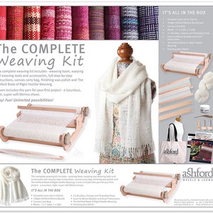 May include: A complete weaving kit with a wooden loom, tools, and yarn. The kit includes a canvas carry bag, finishing wax polish, and a book on rigid heddle weaving. The kit is shown with a white merino wool shawl, which is the project that can be made with the kit. The text on the image reads "The Complete Weaving Kit" and "It's All in the Box".