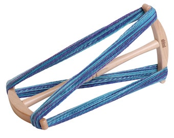 May include: A wooden yarn swift with a blue and purple yarn wound around it. The swift is made by "Schacht Spindles".