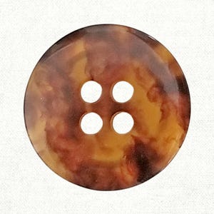 May include: A round button with a tortoiseshell pattern in shades of brown and yellow. The button has four evenly spaced holes in the center for sewing. The button is set against a white background.