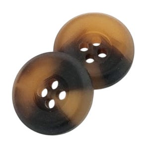May include: Two brown and black plastic buttons with four holes each.