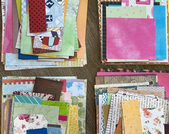 Peut inclure: Un assortiment de morceaux de papier à motifs colorés de différentes formes et tailles. L'ensemble comprend des papiers à pois, des motifs floraux et des graphiques sur le thème du voyage. Les papiers sont disposés en piles, parfaits pour le scrapbooking ou les loisirs créatifs.