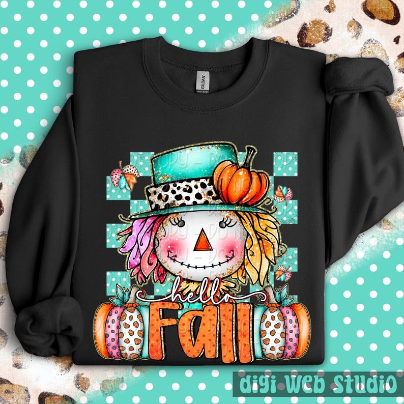 May include: Black sweatshirt featuring a colorful scarecrow design with a teal hat, orange pumpkin, and the words "hello FALL". The scarecrow has pink, yellow, and orange hair, and is set against a teal and white checkered background.