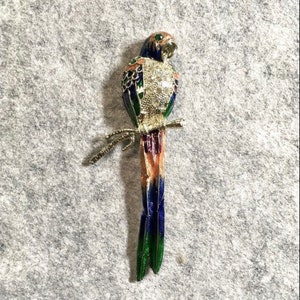 Rhinestone and enamel parrot brooch on silvertone metal, circa 1990s