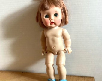 R&B walker doll (Arranbee). 11 inches tall, as shown. Hard plastic, circa 1950s.