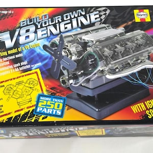 May include: A boxed V8 engine model kit with the text "Build Your Own Engine". The kit includes over 250 parts, is motorized, and has illuminating spark plugs. The box also states "With Ignition Sound".