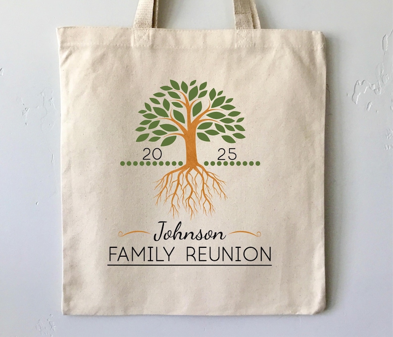 May include: A white canvas tote bag with a green tree design and the text "Johnson Family Reunion". The tree has orange roots and green leaves. There are 20 green dots on one side of the tree and 25 green dots on the other side.