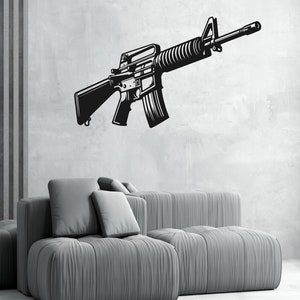 May include: Black and white silhouette of a rifle on a gray wall with a gray couch in the foreground.