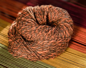 There and back again hand spun aran weight yarn - natural and madder root dyed