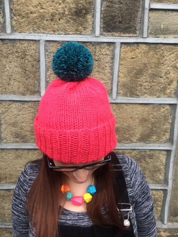 bright pink bobble hat