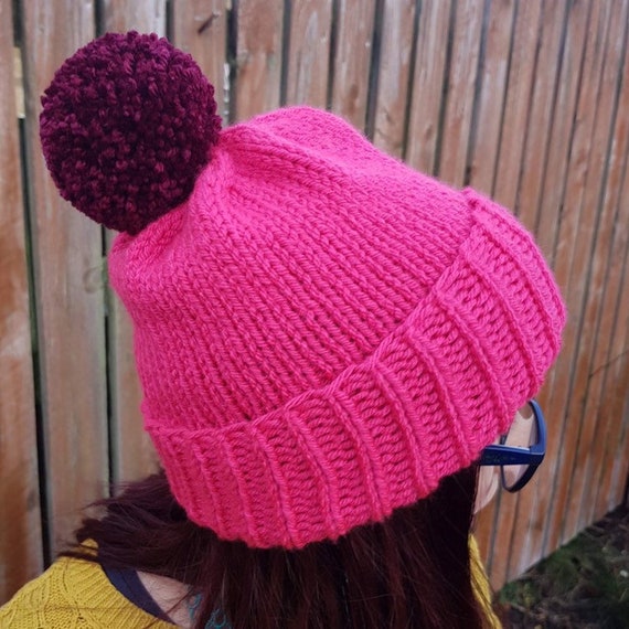 bright pink bobble hat