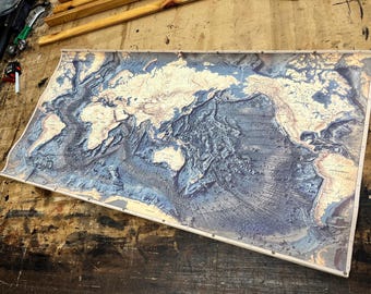 Oceanic history gift, US Navy souvenir gift, fine canvas map, horizontal, showing oceans floor with mountain ridges and labeled depths