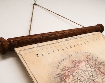 Old Egypt decor, Cotton map with wooden scrolls and jute rope. Map showing river Nile from Asuan to Mediterranean, including Cairo, Suez
