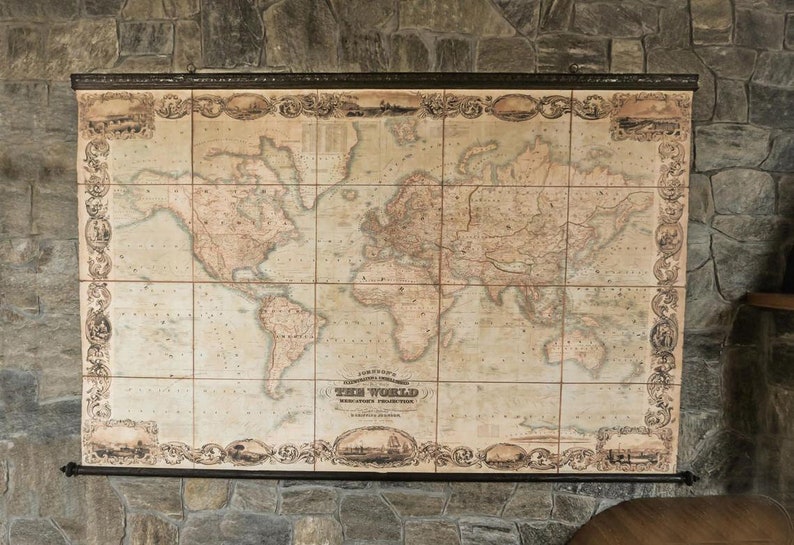 May include: A detailed, vintage world map, mounted on a wall. The map, with a sepia colour scheme, is framed by an elaborate border. The map is divided into rectangular tiles and includes the text "THE WORLD".