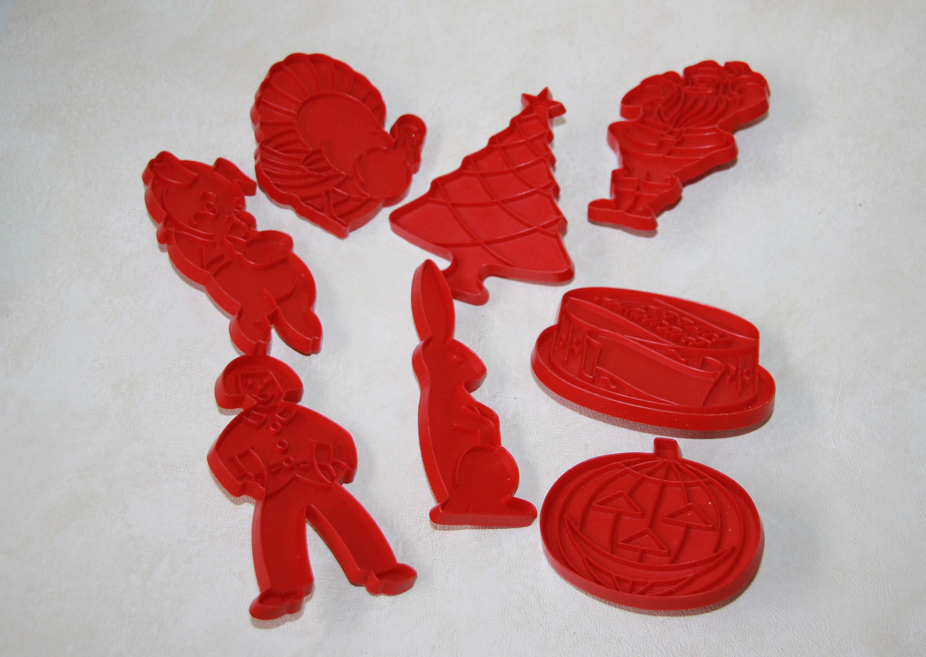 Tupperware red plastic holiday cookie cutters - vintage baking