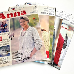 May include: A stack of vintage German knitting magazines, featuring the title "Anna" on the front cover. The magazines are from 1996 and feature various knitting patterns and instructions.