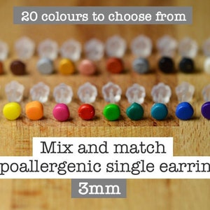 May include: Twenty different colored 3mm hypoallergenic single earrings. The colors include white, yellow, orange, red, pink, green, blue, and purple. Mix and match.