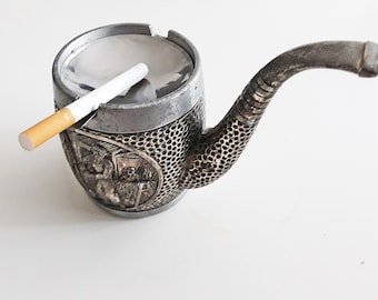Cenicero metálico con forma de tubo