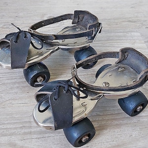 Rollerskating .Vintage rollerskating . Old skates . Metal rollerskating  Adjustable size metal