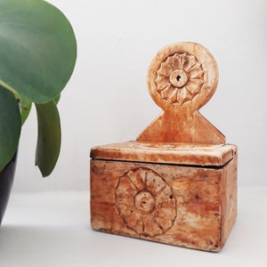 Vintage wooden salt container.