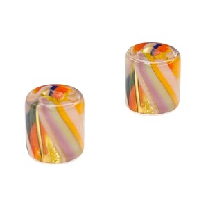 May include: Two cylindrical glass beads with colorful, swirled patterns. The beads feature a mix of orange, yellow, purple, and blue hues, with a transparent base. The design is reminiscent of a candy cane or a swirled lollipop.