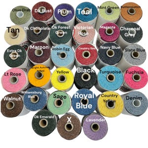 May include: A collection of 25 spools of twine in various colours, including teal, plum, dark rust, olive drab, tan, dark chocolate, dark forest green, Victorian rose, country red, magenta, charcoal grey, navy blue, slate blue, bright autumn yellow, yellow, black, turquoise, fuchsia, light rose, Williamsburg blue, sage, royal blue, country yellow, denim, dark emerald, x, and lavender.