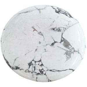 May include: A white howlite cabochon with black veining. The stone is round and smooth.