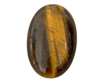 May include: A smooth, oval-shaped tiger's eye stone with a golden brown and black color pattern.