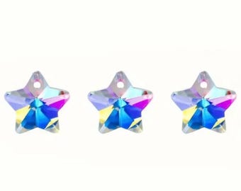 May include: Three iridescent star-shaped crystal charms with a hole for stringing. The charms are a mix of blue, pink, and yellow.