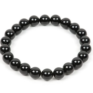 May include: A black beaded bracelet with round beads.