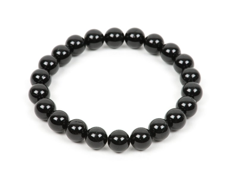 May include: A black beaded bracelet with round beads.