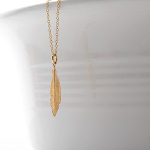 Gold feather necklace
