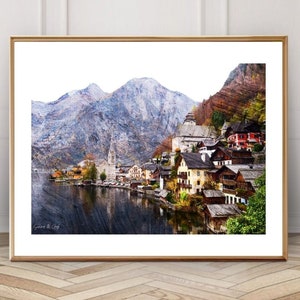 Peut inclure: Une peinture &agrave; l'aquarelle d'un petit village nich&eacute; dans une vall&eacute;e montagneuse. Le village est entour&eacute; d'arbres verdoyants et d'un lac bleu scintillant. Les montagnes sont enneig&eacute;es et le ciel est bleu clair.