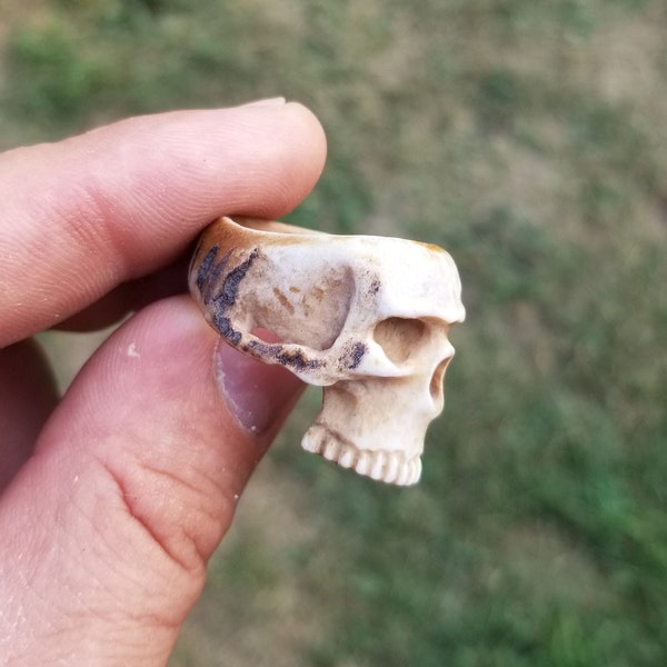 Hand carved half skull ring