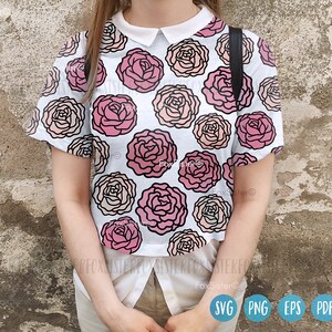 May include: A white collared shirt with a pink and white floral pattern. The shirt has short sleeves and a relaxed fit.