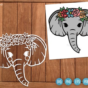 May include: A white silhouette of an elephant wearing a flower crown. The elephant has a gray body and large ears. The flower crown is made of pink, red, yellow, and blue flowers.