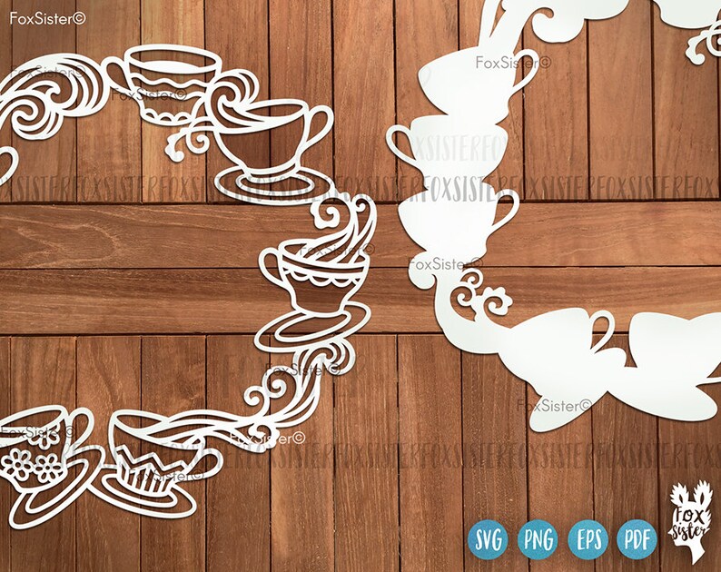 May include: White silhouette of a teacup and teapot wreath with floral details. The wreath is on a wood background.