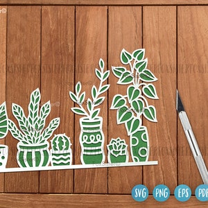 May include: A digital cut file design featuring six potted plants with different leaf shapes and patterns. The plants are in white pots with green, black, and white patterns. The design is perfect for creating home decor, cards, and other crafts.