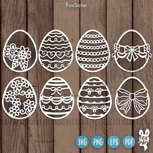 May include: Set of eight white, laser-cut, intricate designs of Easter eggs. Each egg features a different pattern, including floral, geometric, and bow designs.