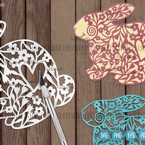 May include: Three digital cut files of bunnies with floral designs. The bunnies are in white, yellow, and blue. The files are labeled SVG, PNG, EPS, and PDF.