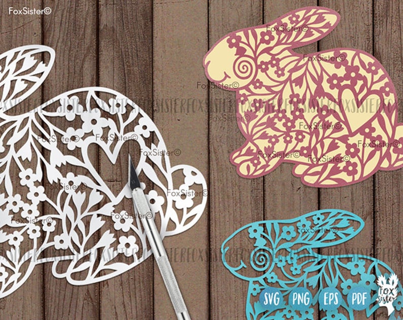 May include: Three digital cut files of bunnies with floral designs. The bunnies are in white, yellow, and blue. The files are labeled SVG, PNG, EPS, and PDF.