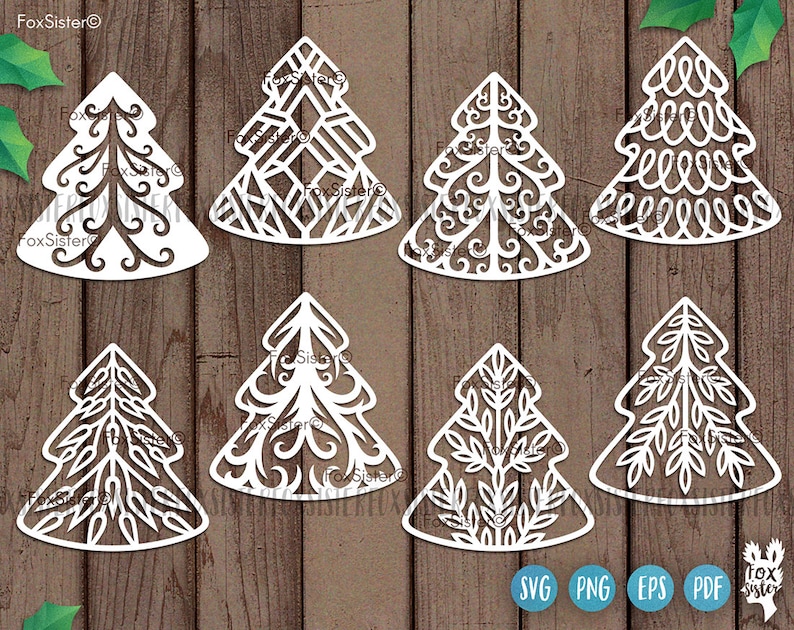 May include: Set of ten white paper cut-out Christmas tree designs with intricate patterns. The designs include geometric, floral, and leaf motifs.